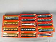 Hornby - A group of 14 boxed OO gauge coaches.