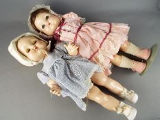 Roddy Dolls - A pair of walking Roddy Dolls with stands consisting of a baby Roddy Doll with
