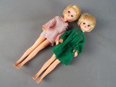 Pedigree Sindy - two Sindy dolls, both blonde with short hair, painted eyebrows,