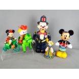 A collection of battery and clockwork operated toys to include a Bump and Go Clown Policeman,