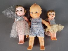 Kewpie Dolls - A collection of three Kewpie Dolls to include a celluloid female doll with jointed