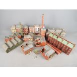 A small collection of OO Gauge railway plastic and cardboard layout buildings and accessories