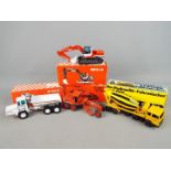 Gescha, NZG - Four boxed diecast 1:50 scale construction vehicles.