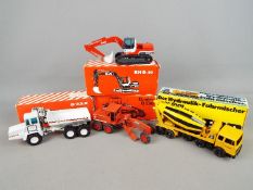 Gescha, NZG - Four boxed diecast 1:50 scale construction vehicles.