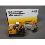 NZG - A boxed diecast 1:50 scale NZG #678 Liebherr R313 Litronic Hydraulic Excavator.