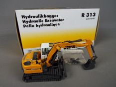 NZG - A boxed diecast 1:50 scale NZG #678 Liebherr R313 Litronic Hydraulic Excavator.