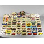 Lledo - A boxed collection of 74 diecast vehicles by Lledo.