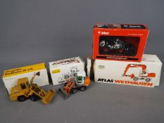 NZG,Conrad, BYMO - Four boxed diecast construction vehicles in 1:50 scale.