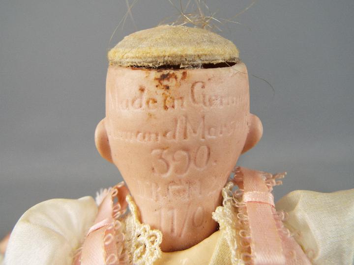 Armand Marseille - a bisque headed female doll with hand painted eyebrows eyelashes and lips with - Image 5 of 6