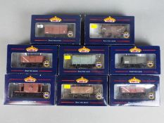 Bachmann - Eight boxed OO gauge items of freight rolling stock.