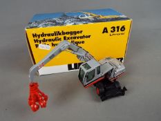 NZG - A boxed 1:50 scale diecast NZG #497 Liebherr Heinrich Lilienkamp A316 66 Litronic Hydraulic