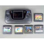 Sega - An unboxed Sega Game Gear portable video game system with 5 unboxed games including Primal