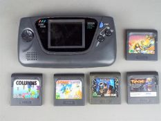 Sega - An unboxed Sega Game Gear portable video game system with 5 unboxed games including Primal