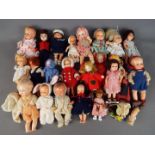 Dolls - a good collection of small predominantly jointed plastic baby dolls in clothing
