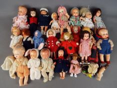 Dolls - a good collection of small predominantly jointed plastic baby dolls in clothing