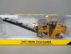 Norscot - A boxed 1:50 scale diecast Norscot #55286 Caterpillar PM200 Cold Planer.