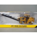 Norscot - A boxed 1:50 scale diecast Norscot #55286 Caterpillar PM200 Cold Planer.