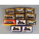 Hornby, Bachmann, Mainline - 11 boxed items of boxed OO gauge freight rolling stock.
