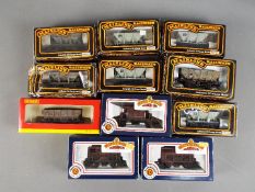 Hornby, Bachmann, Mainline - 11 boxed items of boxed OO gauge freight rolling stock.