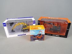 NZG, Universal Hobbies - Three boxed diecast 1:50 scale diecast construction vehicles.