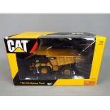 Tonkin Replicas - A boxed boxed diecast 1:50 scale Tonkin Replicas TR30002 775G Off-Highway Truck.