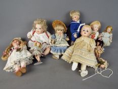 Porcelain Collector Dolls - a collection of eight contemporary porcelain faced collector dolls