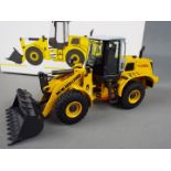 NZG - A boxed diecast 1:50 scale NZG #819 New Holland W170B.