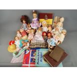 Dolls - a collection of in excess of twelve good quality mid century dolls with sleeping eyes,