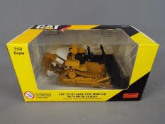 Norscot - A boxed 1:50 scale diecast Norscot #55212 Caterpillar D11T Track Type Tractor with Metal