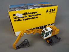 NZG - A boxed diecast 1:50 scale NZG #497 Liebherr A316 Litronic Hydraulic Excavator / Material