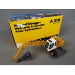 NZG - A boxed diecast 1:50 scale NZG #497 Liebherr A316 Litronic Hydraulic Excavator / Material