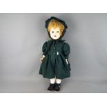 Pedigree Dolls - a large female Pedigree Walker Doll with a composition head, sleeping blue eyes,