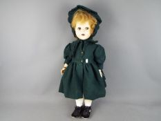 Pedigree Dolls - a large female Pedigree Walker Doll with a composition head, sleeping blue eyes,