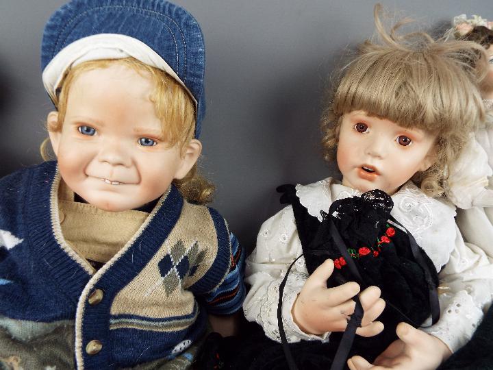 Porcelain Collector Dolls - two large porcelain collector dolls in the form of a girl and a boy, - Image 2 of 4