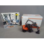 NZG, Wirtgen - Two boxed diecast construction vehicles in 1:50 scale.