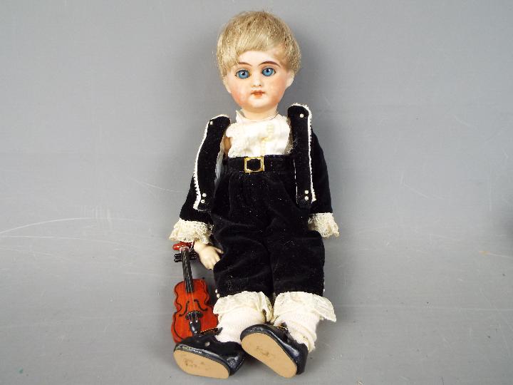 Armand Marseille - a bisque headed female doll with hand painted eyebrows eyelashes and lips with - Image 2 of 6