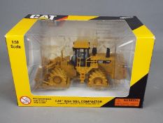 Norscot - A boxed 1:50 scale diecast Norscot #55165 Caterpllar 825H Soil Compactor.