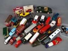 Burago, Saico and others - approximately 32 predominantly unboxed diecast model motor vehicles,