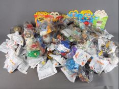 McDonalds - A group in excess of 50 collectible Fast Food / Promotional toys and products.