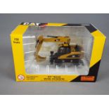 Norscot - A boxed 1:50 scale diecast Norscot #55171 Caterpillar M316D Wheel Excavator.