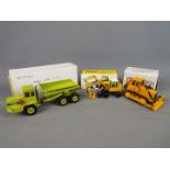 NZG, Conrad, Cursor - Three boxed diecast 1:50 scale construction vehicles.