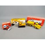 Conrad, NZG - Three boxed diecast 1:50 scale construction vehicles.