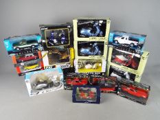 New Ray, Jada, Rastar, Welly - A collection of 16 boxed dievast model vehicles in various scales.