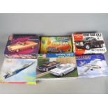 Lindberg, AMT, Tamiya, Xtrakit, Hobby Boss, Revell - Six boxed plastic model kits in various scales.