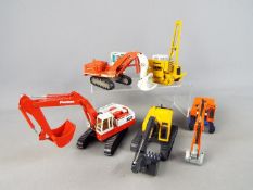 Conrad, Joal, NZG, Siku, Five unboxed 1:50 scale diecast construction vehicles.