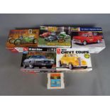 AMT, Revell - Six boxed plastic model car and accessory kits in 1:25 scale.