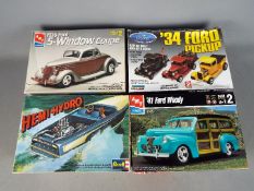 Lindberg, AMT, Revell - Four boxed plastic model kits in 1:25 scale.