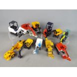 Conrad, Joal, NZG, Others - 11 unboxed diecast construction vehicles in various scales.