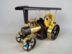 Wilesco - An unboxed Wilesco live steam D406 brass and black steam traction engine.