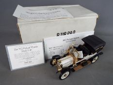 Franklin Mint - A boxed Franklin Mint diecast 1:24 scale 1912 Packard Victoria Model 1-48 .